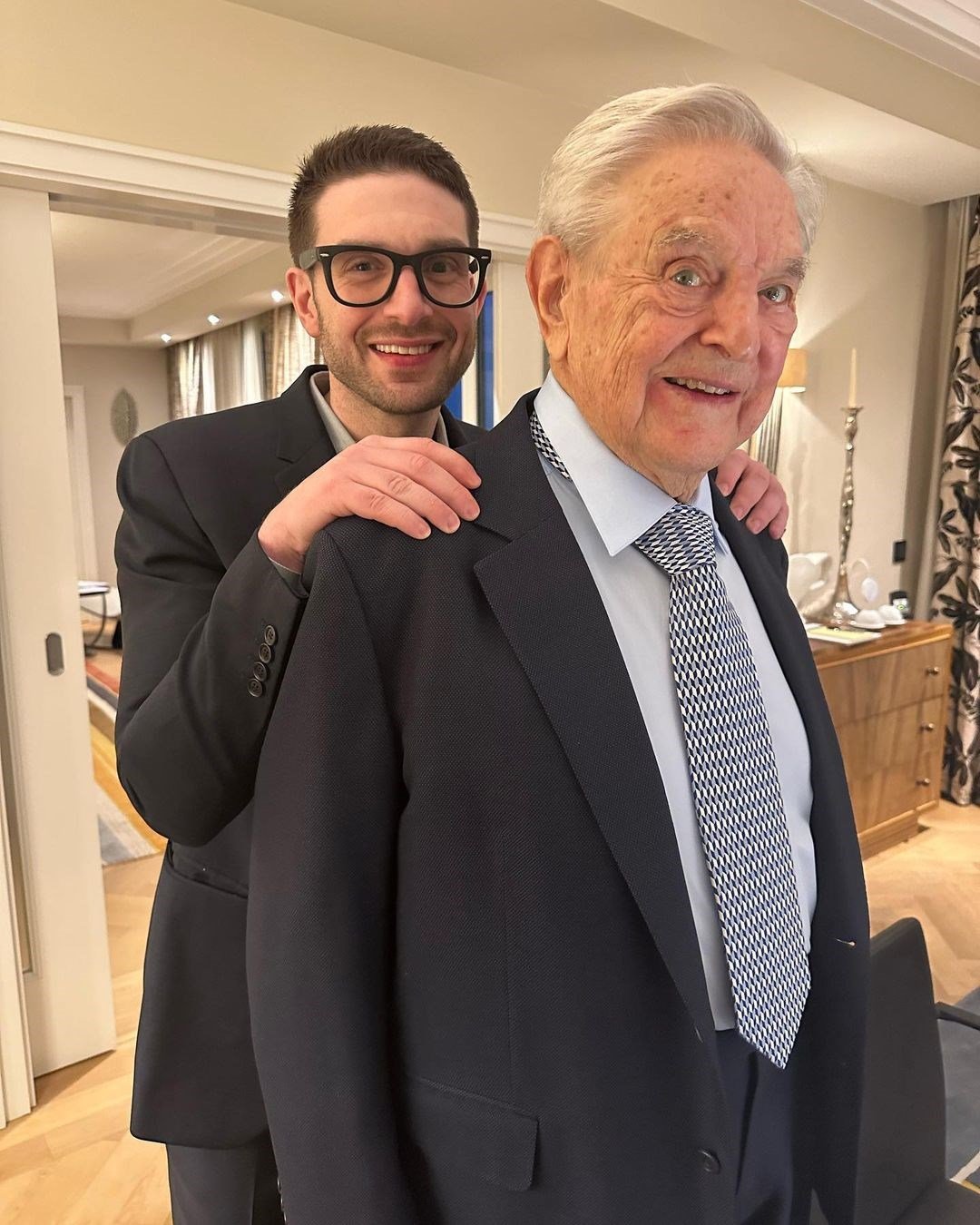 Instagram photo posted on Alexander Soros' personal account where he stands behind his father George Soros at Munich Security Conference, 17 February 2023. (@alexsoros/Instagram)