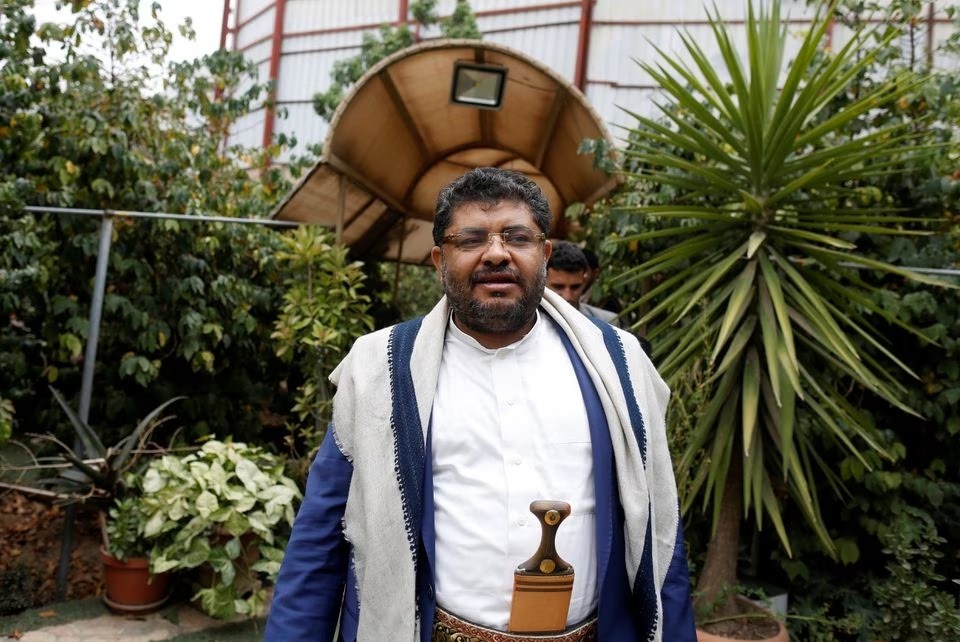 Mohammad Ali Al-Houthi, member of the Supreme Political Council in Yemen, walks after an interview in Sanaa, Yemen, 1 August 2018.(Reuters)
