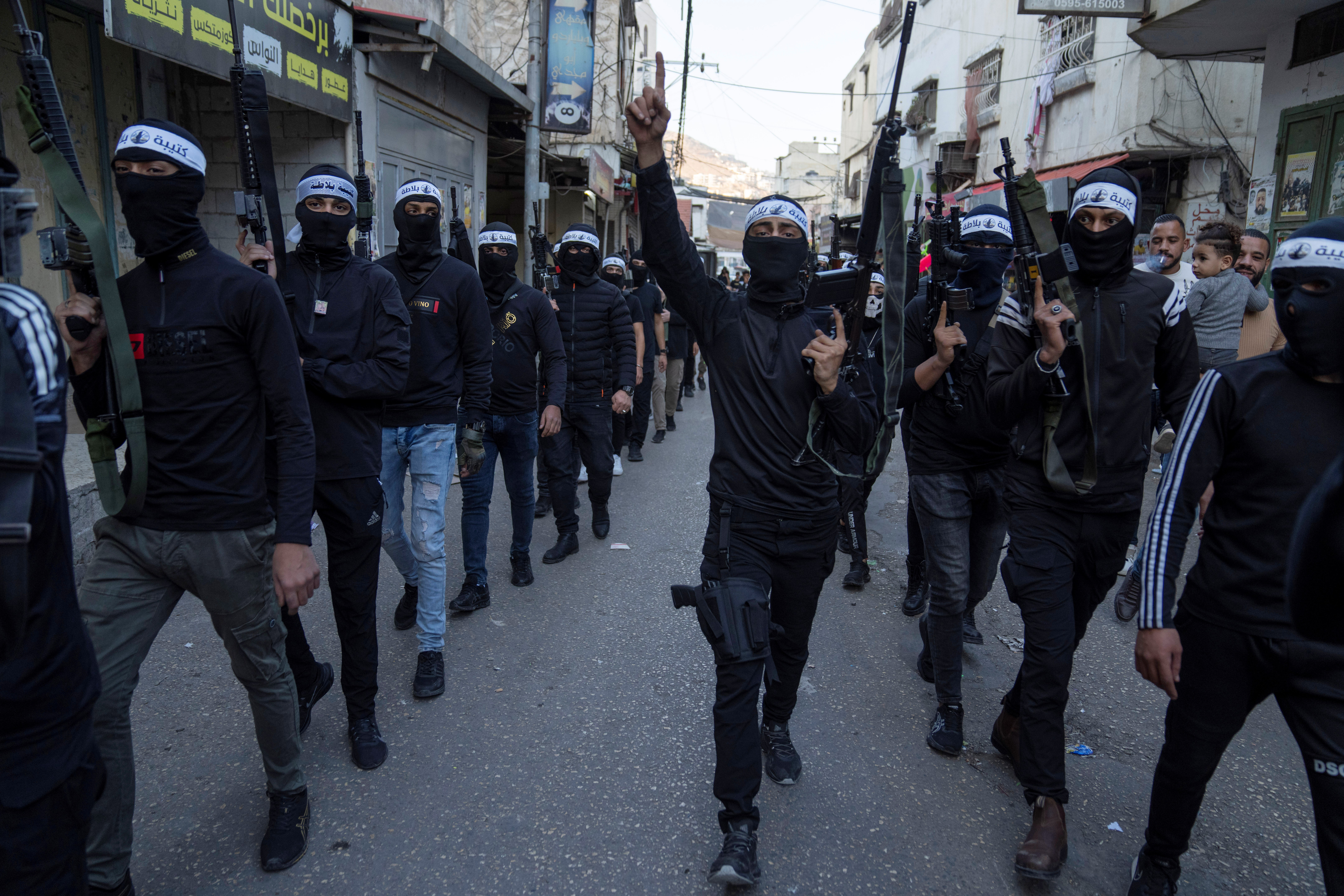 Palestinian Resistance Brigade in a military parade, in the West Bank refugee camp of Balata, near Nablus, Friday, Nov. 4, 2022. (AP)
