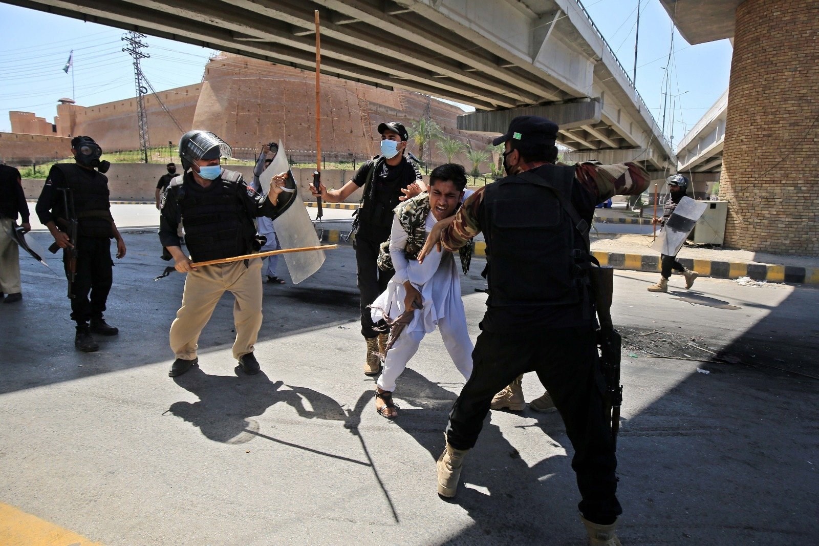 Pakistan Tehreek-e-Insaf (PTI) party activists and supporters of former Prime Minister Imran Khan brutally beaten by police in Peshawar, Pakistan, May 10, 2023. (AFP Photo)