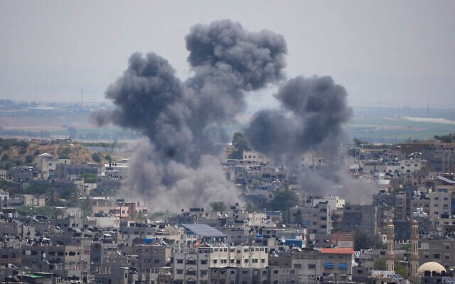 Smoke rises from an Israeli airstrike on a residential area in Gaza Strip, on May 12, 2023. (AP)