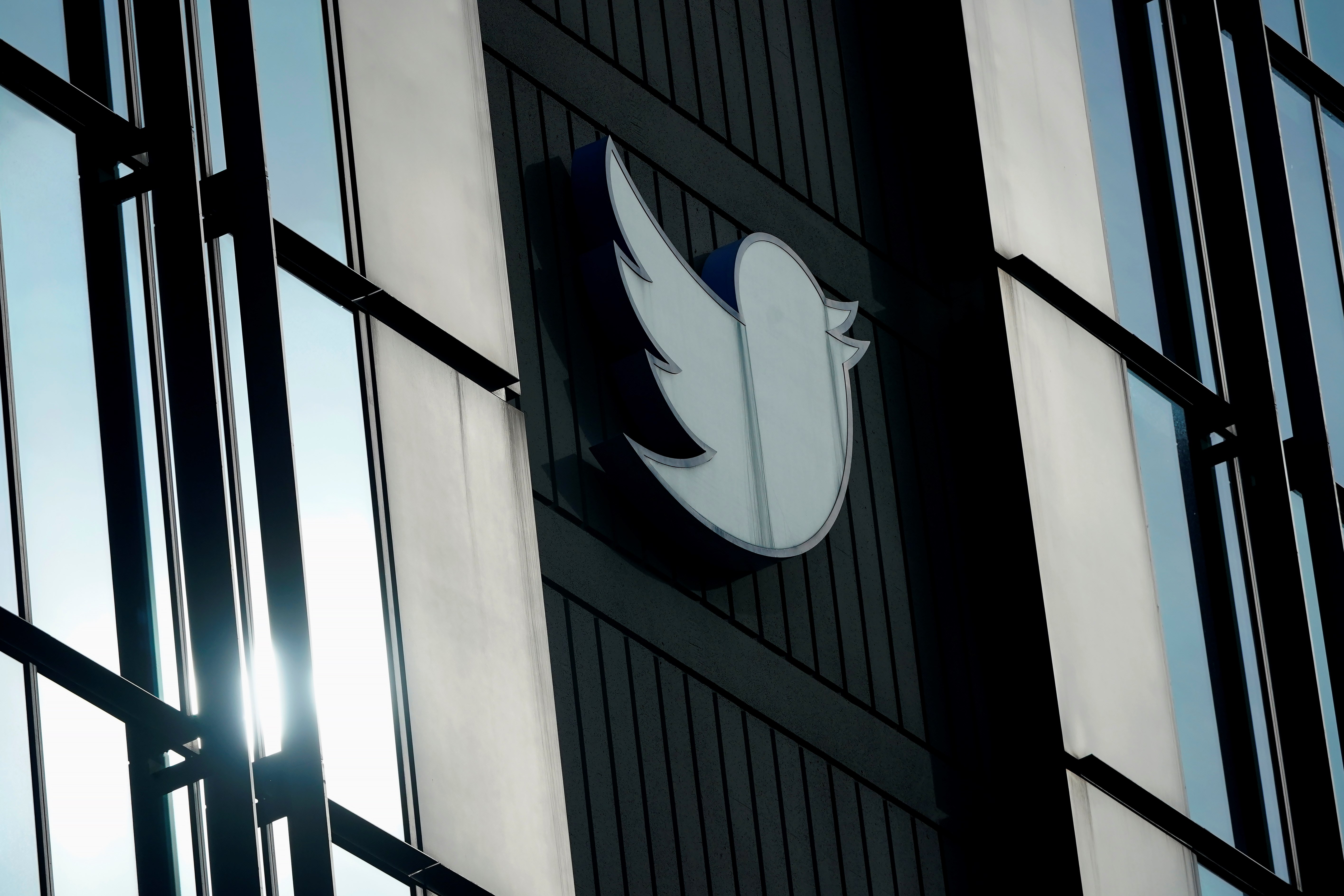A Twitter logo hangs outside the company's offices in San Francisco, on Dec. 19, 2022. (AP)