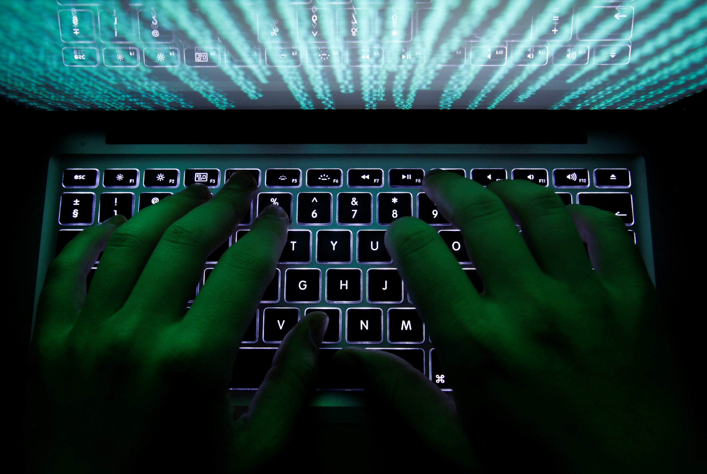 A man types on a computer keyboard in Warsaw in this February 28, 2013 illustration file picture. (Reuters)