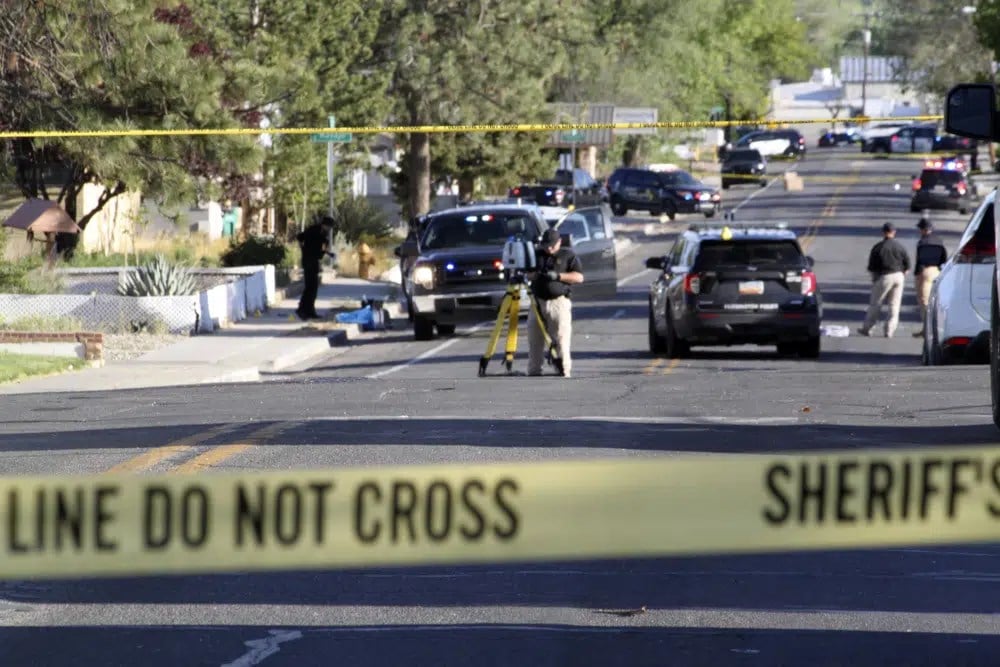 Investigators work along a residential street following a deadly shooting Monday, May 15, 2023, in Farmington. (AP)