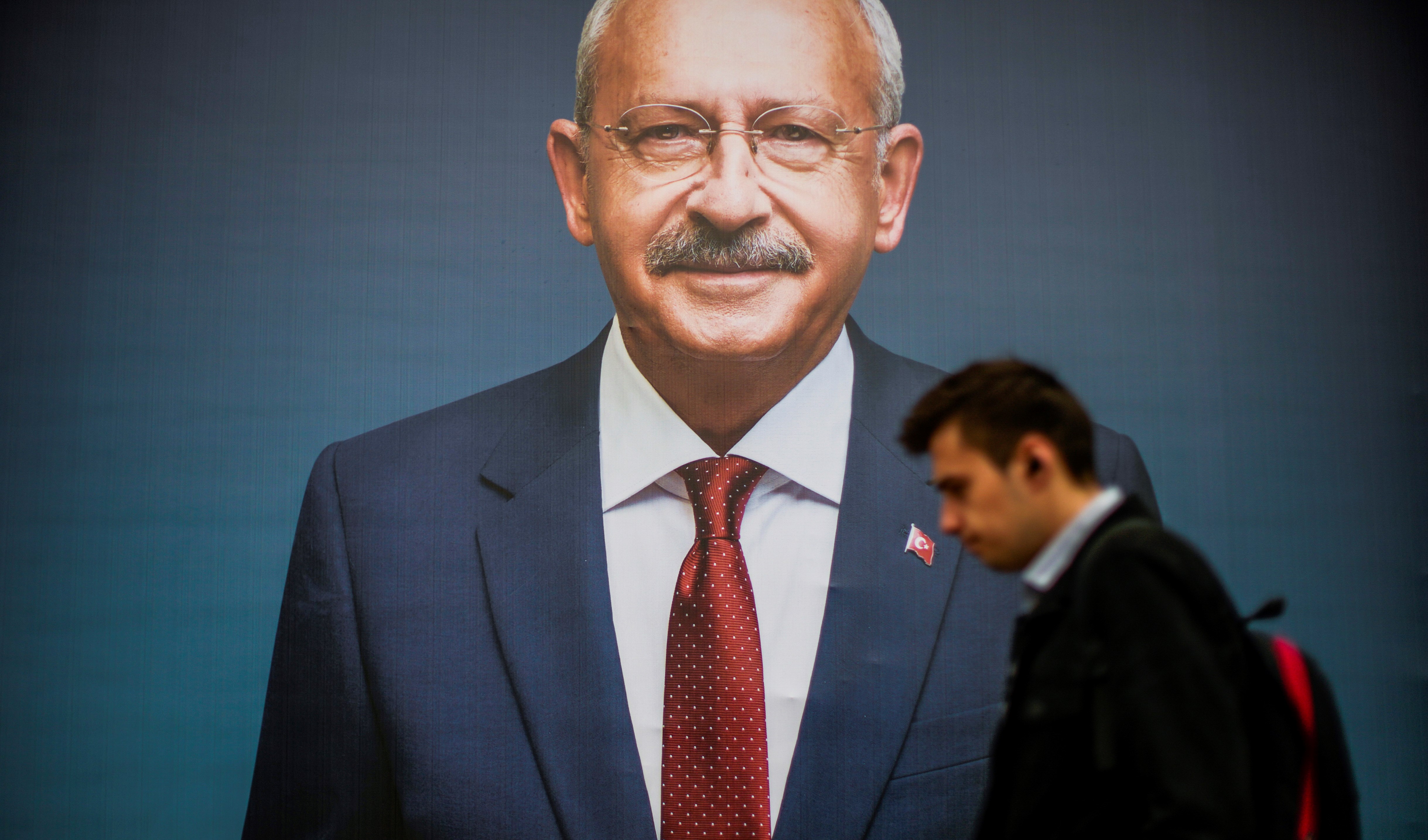 A man walks past a billboard of Turkish CHP party leader and Nation Alliance s presidential candidate Kemal Kilicdaroglu a day after the presidential election day, in Istanbul, Turkey, Monday, May 15, 2023. (AP)