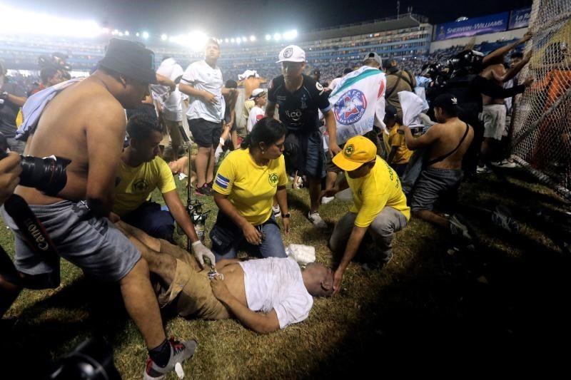 First responders tend to a casualty of the stampede that occurred in the Cuscatlan Stadium, San Salvador, El Salvador,  20 May 2023. (AFP)