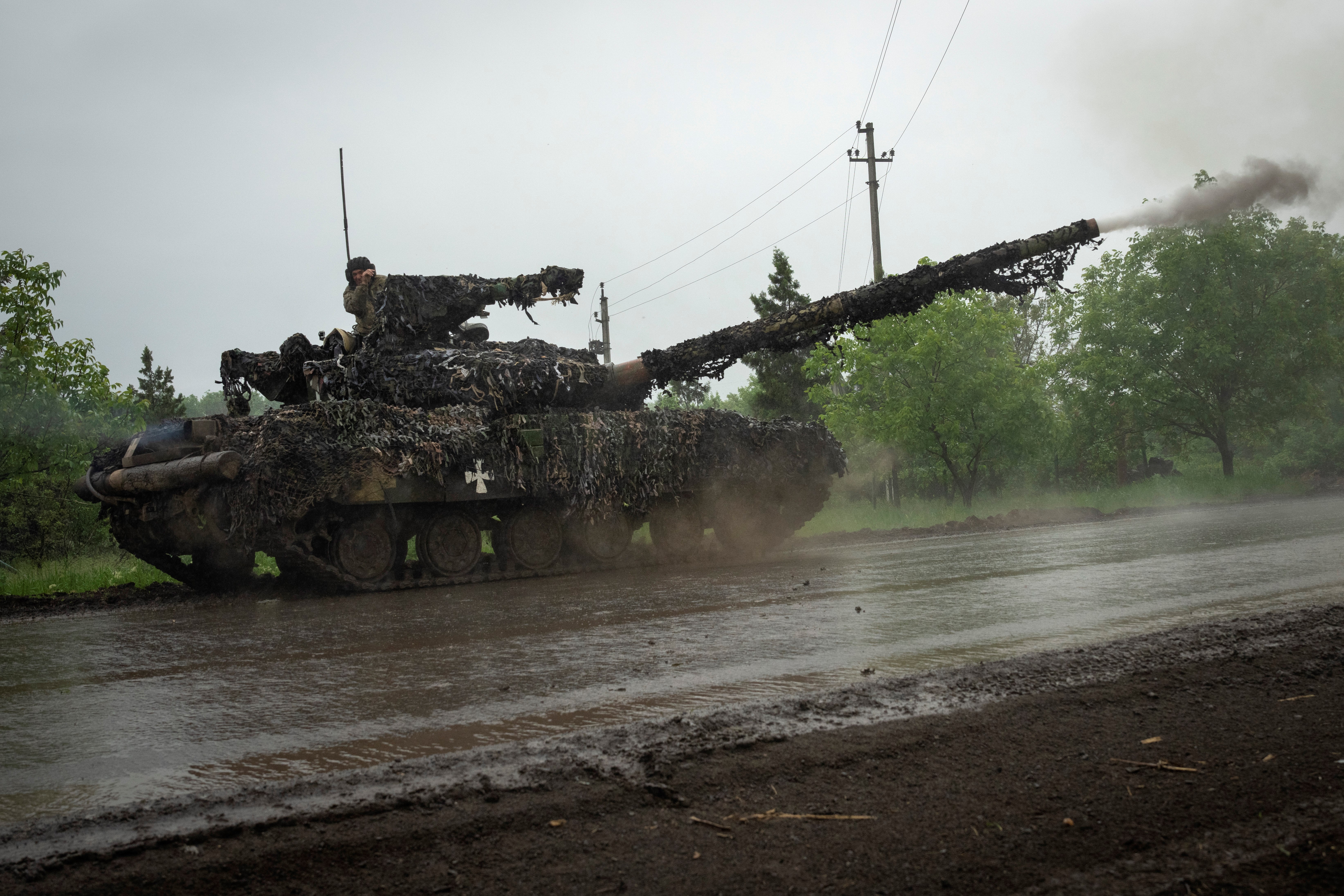 Ukrainian tank fires toward Russian positions at the frontline near Bakhmut, Donetsk region, Tuesday, May 23, 2023 (AP Photo/Efrem Lukatsky)