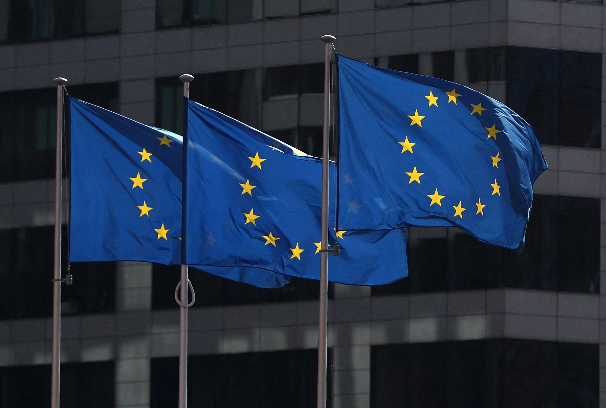 European Union flags fly outside the European Commission headquarters in Brussels, Belgium, on April 10, 2019 (Reuters)