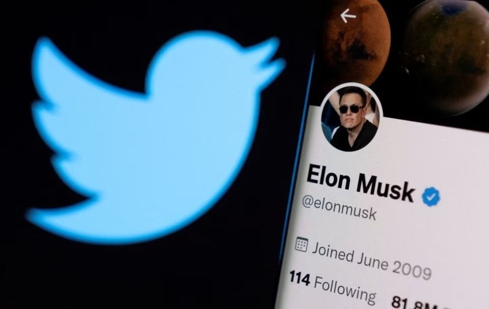 A Twitter logo is displayed in front of Elon Musk's Twitter account, April 15 2022. (Reuters)