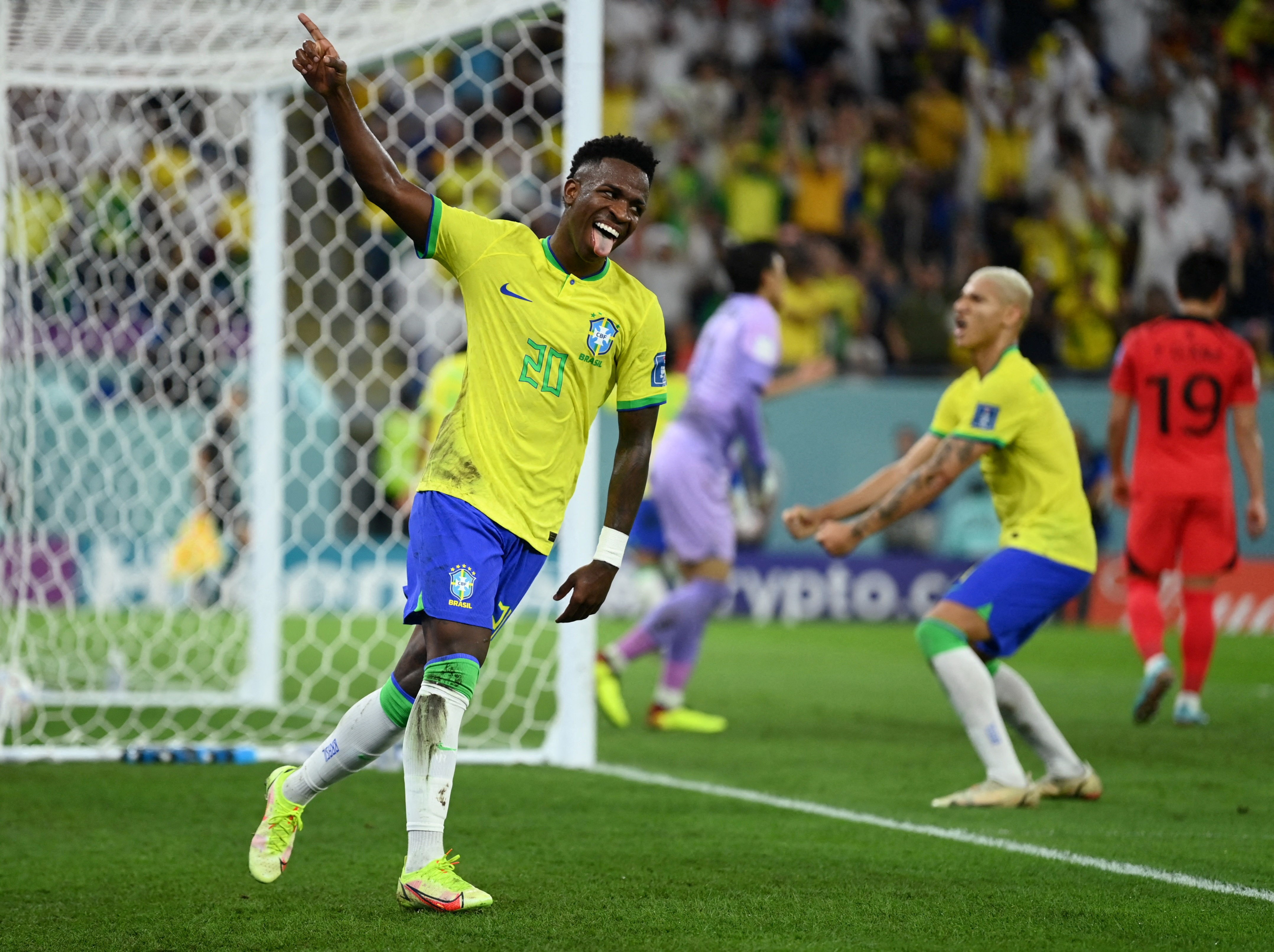 Brazilian forward Vinicius Junior celebrates Lucas Paqueta's goal against South Korea in the Round of 16 of the FIFA World CUP Qatar 2022, Stadium 974, Doha, Qatar, December 5 2022. (Reuters)