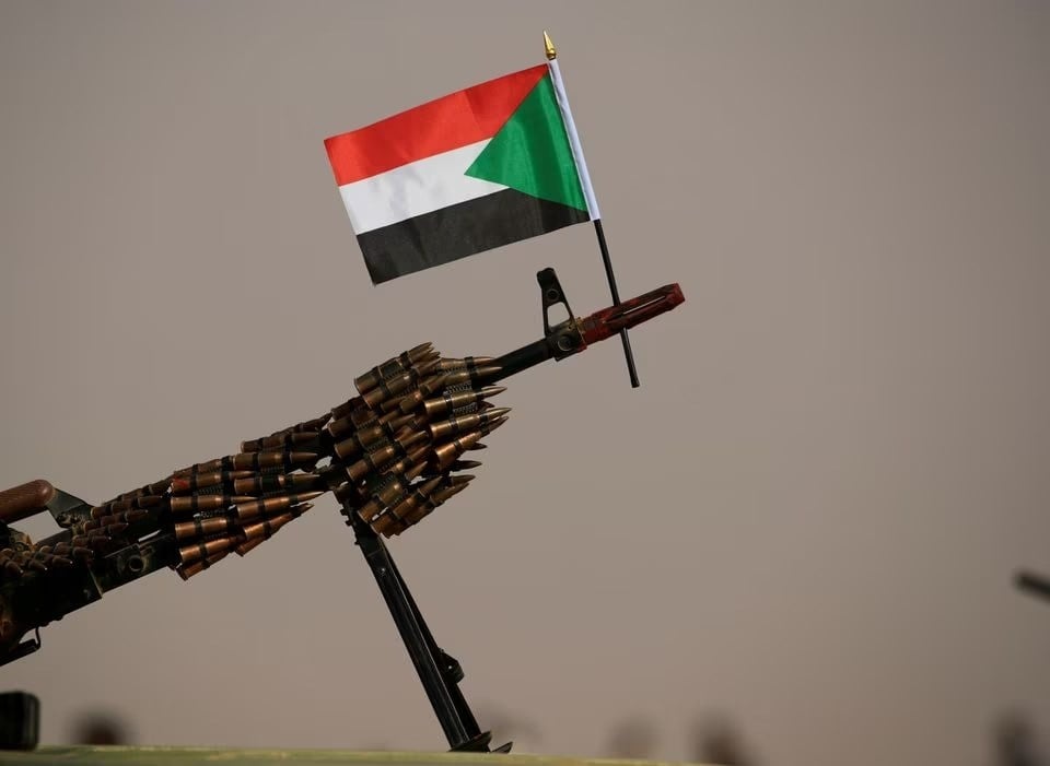 The flag of Sudan is attached on the muzzle of a machine gun belonging to the Rapid Support Forces (RSF) Aprag, Khartoum, Sudan, June 22 2019. (Reuters)