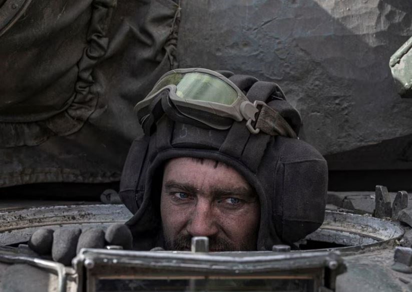 A Ukrainian serviceman sits inside a tank in the village of Lukyanivka outside Kiev, Ukraine, March 27, 2022. (Reuters)