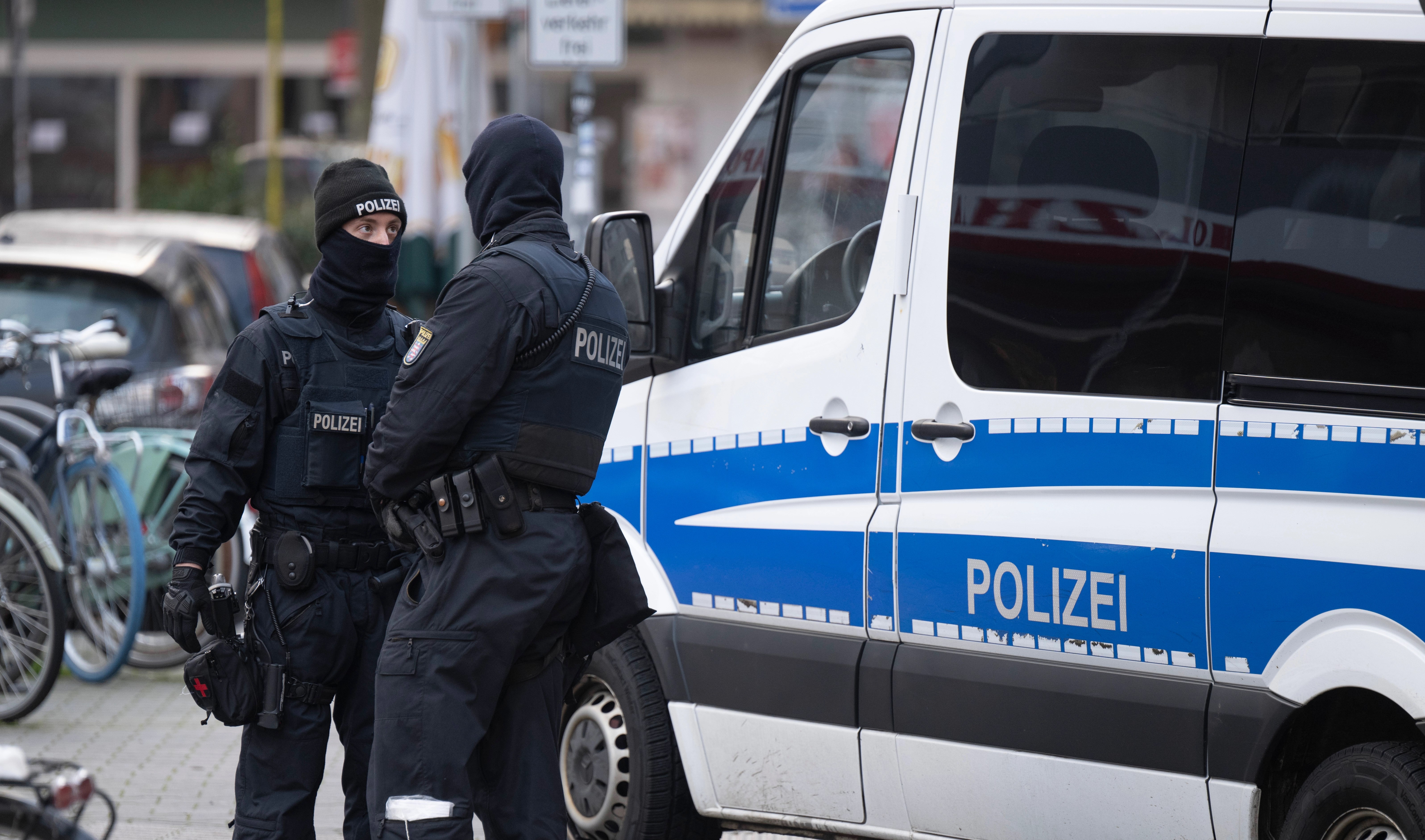 Police officers stand by a searched property in Frankfurt during a raid against so-called ‘Reich citizens’ in Frankfurt, Germany, Wednesday, Dec. 7, 2022 (AP)