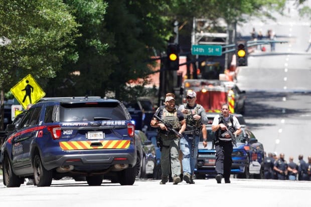 Law enforcement officers arrive near the scene of an active shooter on Wednesday, May 3, 2023 in Atlanta. (AP)