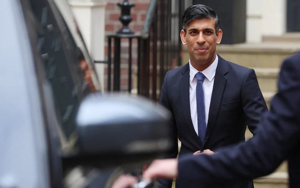 Rishi Sunak leaves the Conservative Party campaign headquarters after addressing supporters on May 2023. (Reuters)