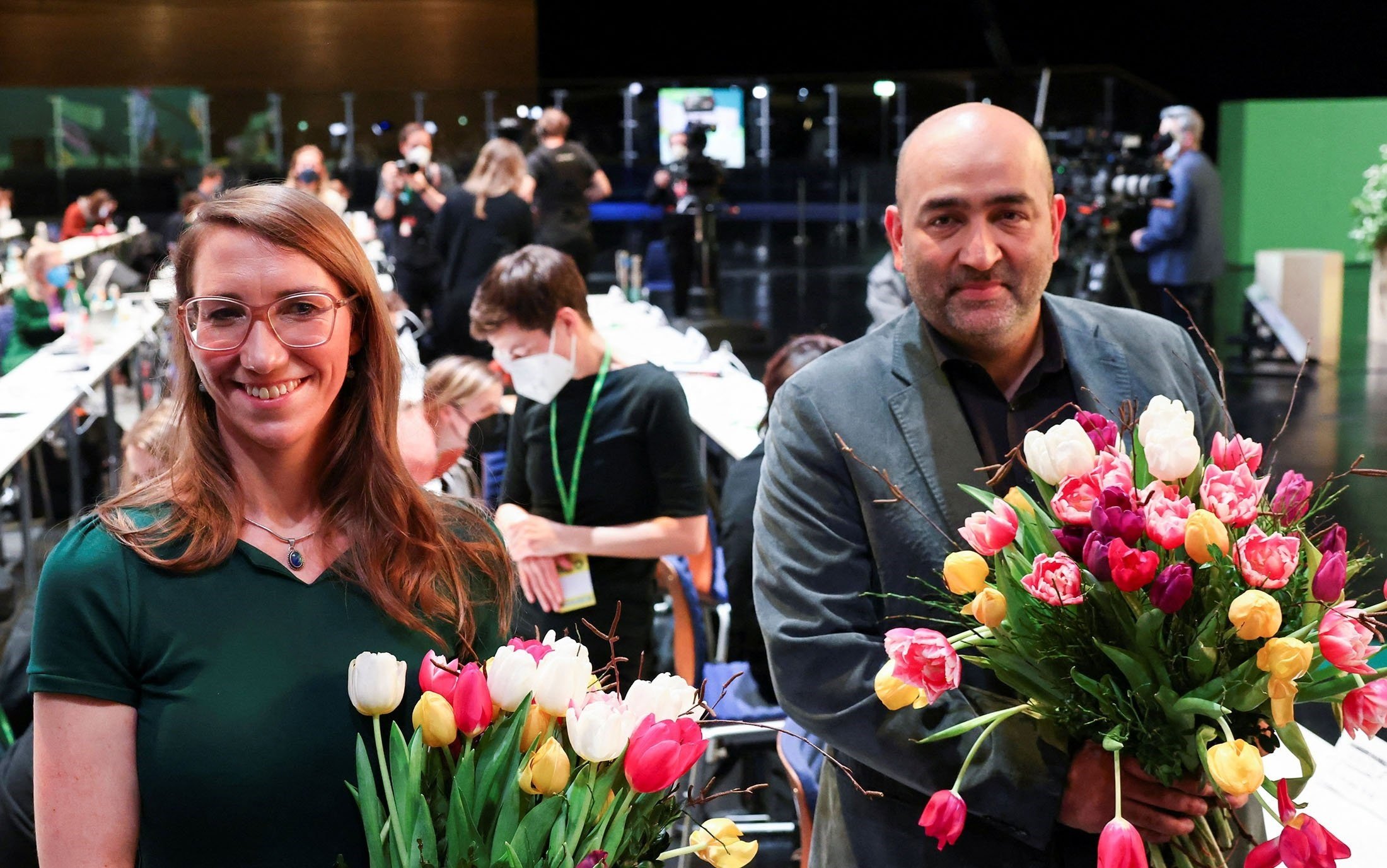 Emily Buning (L), newly elected Greens party Federal Political Director, poses with party politician Omid Nouripour who's been elected as co-party leader, during a Party Congress in Berlin, Germany, Jan. 29, 2022 (Reuters)