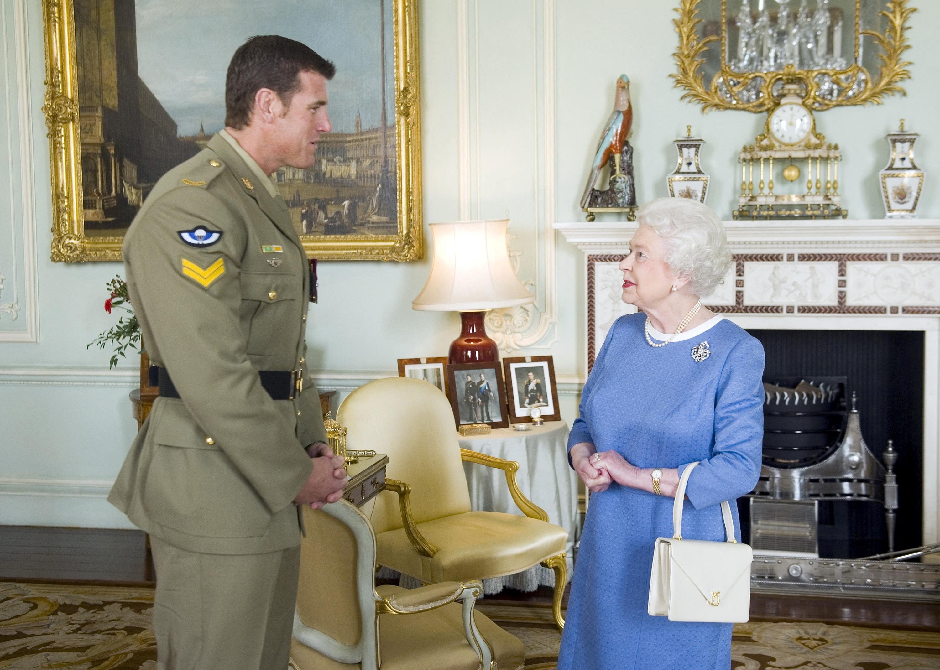 Then Queen Elizabeth II welcomes Australian war criminal SASR Corporal Ben Roberts-Smith, Buckingham Palace, London, UK. November 15 2011. (Reuters)