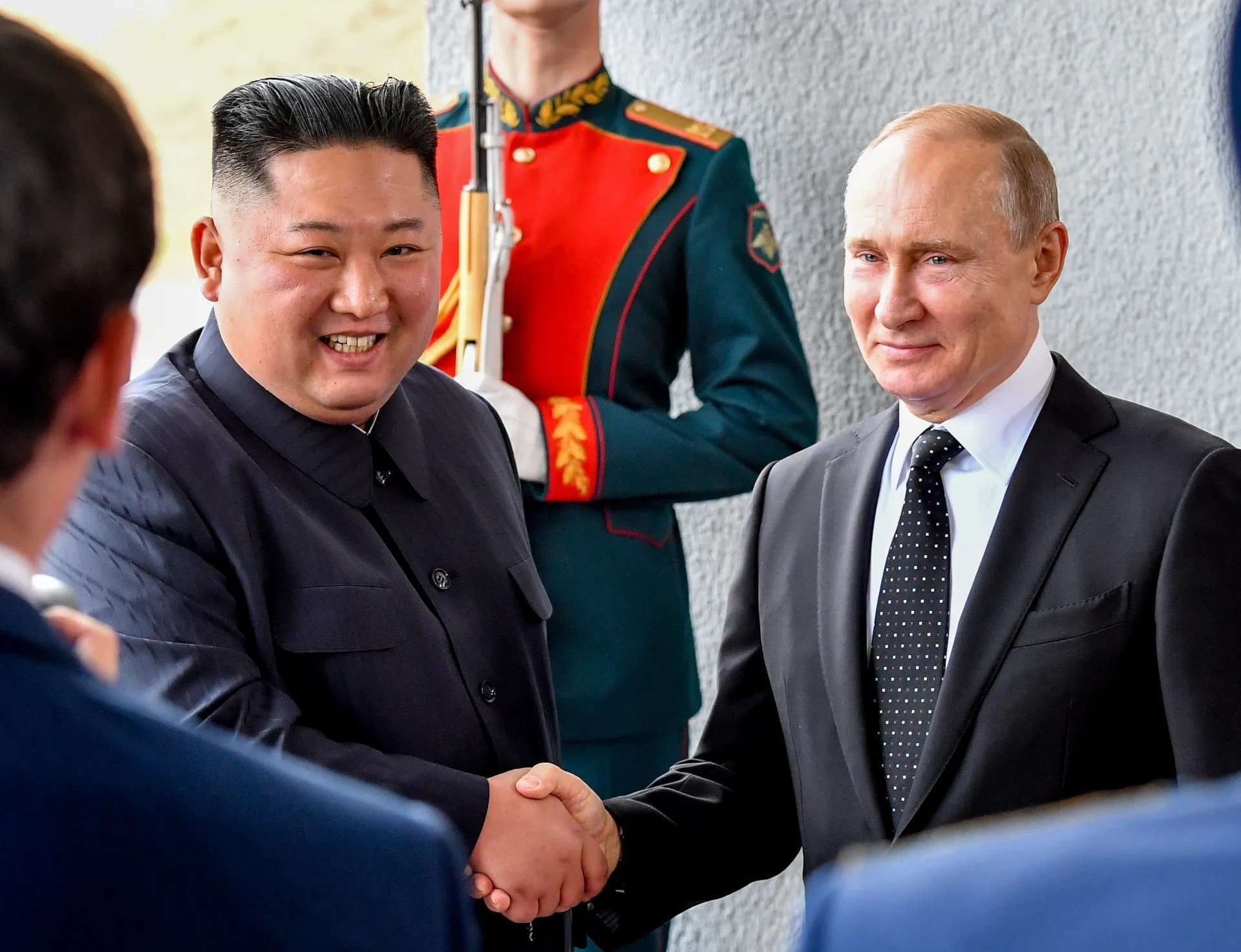 Russian President Vladimir Putin, and North Korea's leader Kim Jong-un shake hands during their meeting in Vladivostok, Russia in 2019
