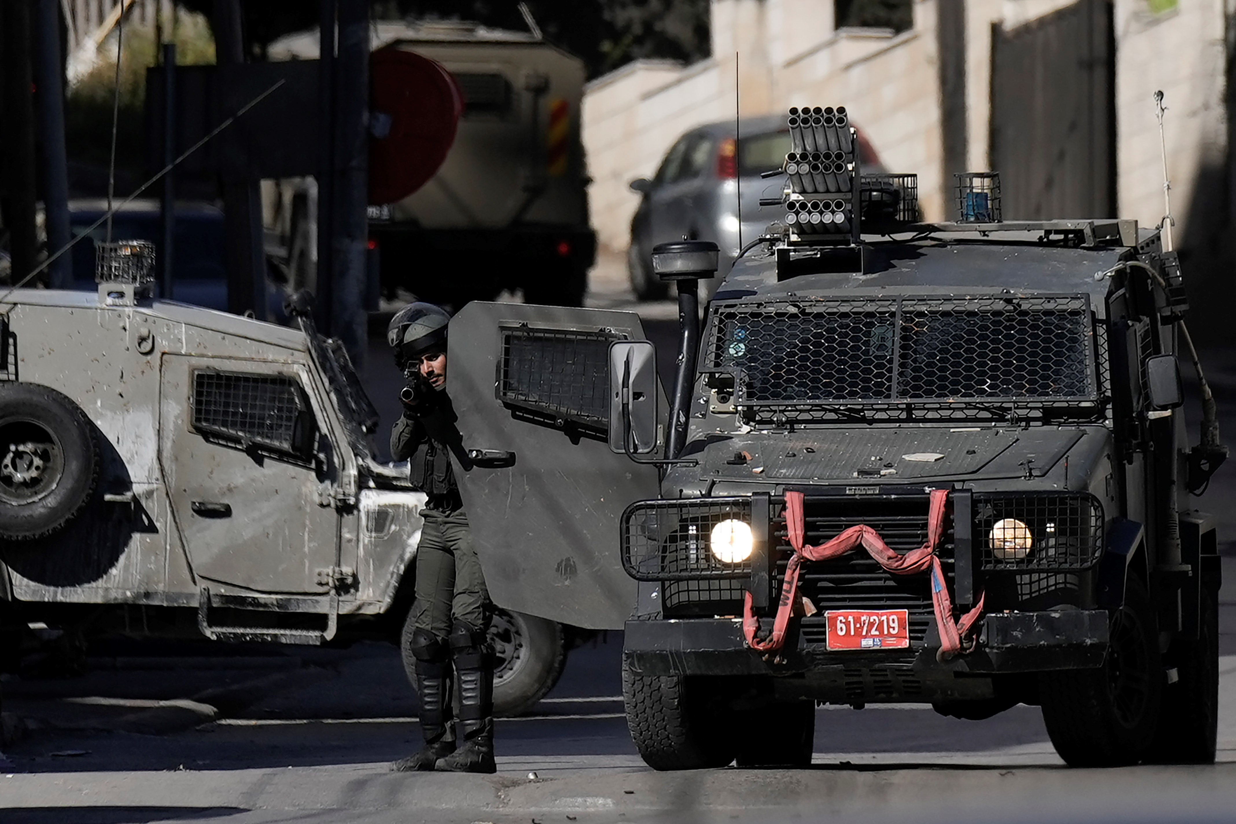 Israel Occupation Forces shoot tear gas during confrontations with Palestinians during a raid in the West Bank city of Nablus, Monday, April 3, 2023. (AP)