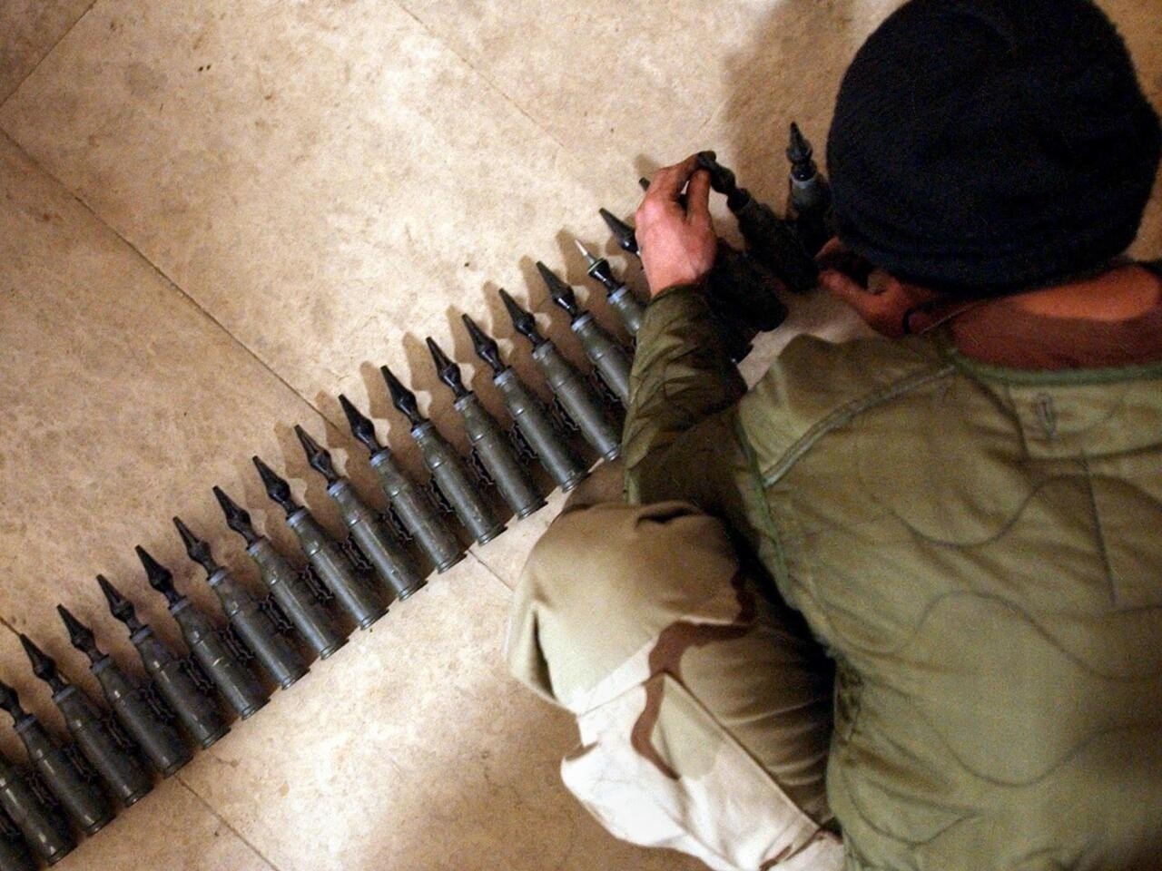 A US soldier counts 25mm rounds of depleted uranium ammunition in Tikrit, Iraq, February 11 2004. (AFP)