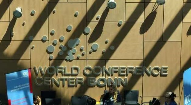 Visitors sit inside the World Conference Center Bonn during the Climate Change Conference in Bonn, western Germany on June 13, 2023. (AFP)