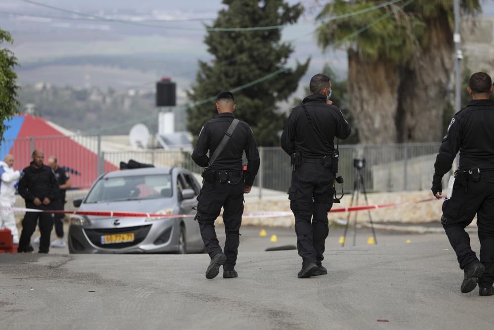 Israeli police forces close an area in occupied Umm Al-Fahm, Palestine, December 3 2021. (AP)