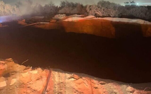 A screen grab from video that shows a crater in the ground in ‘Herzliya’ following a loud explosion, June 22, 2023. (Twitter)