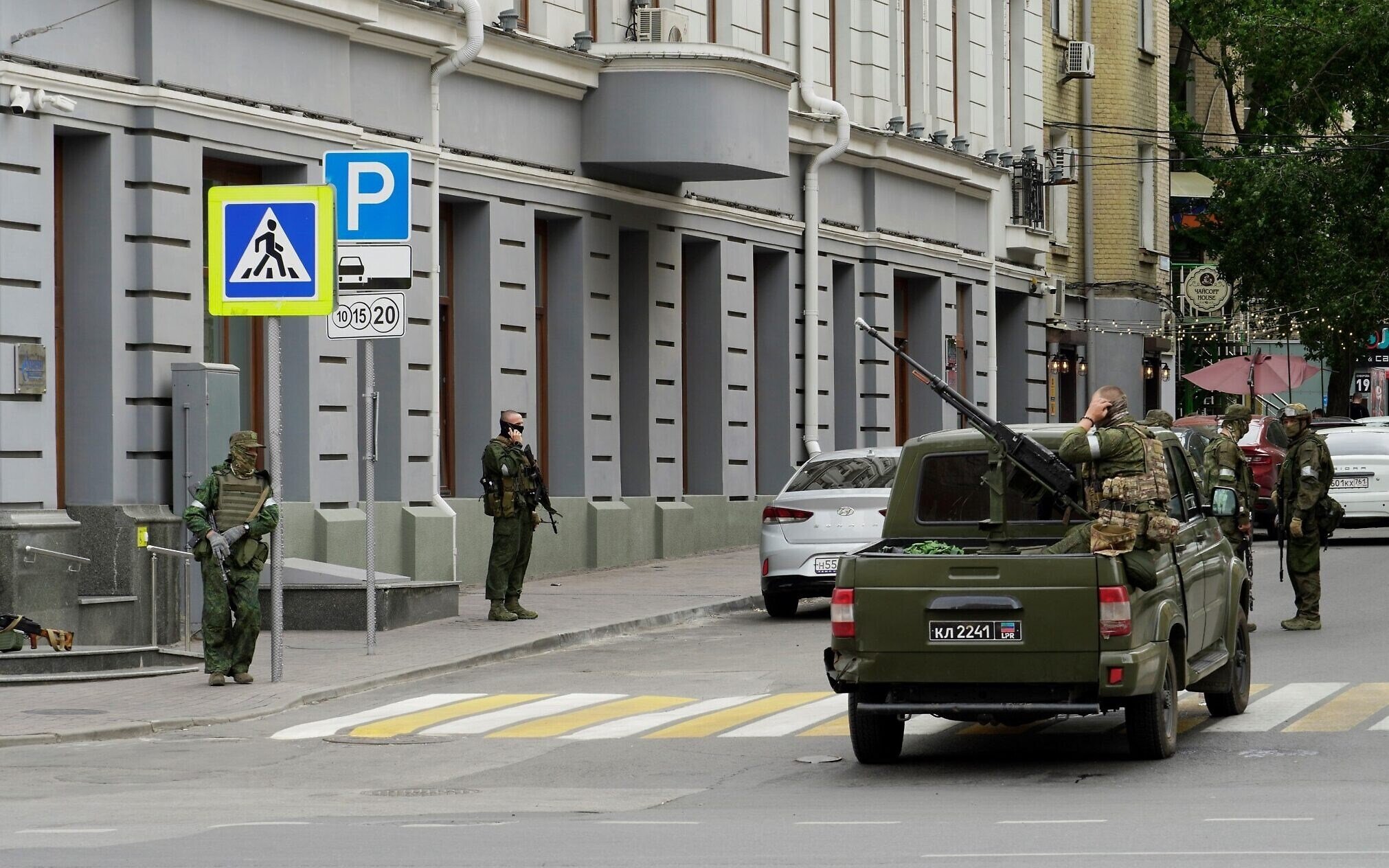 Members of the mercenary Wagner Group stand guard in a street in the Russian city of Rostov-on-Don, on June 24, 2023. (AFP)