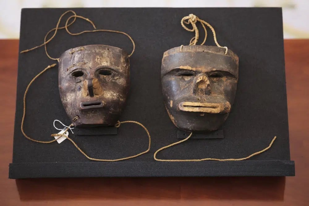 Two masks of the indigenous community of the Kogi from the Sierra Nevada de Santa Marta in Colombia are displayed at German President residence Bellevue Palace in Berlin, Germany, Friday, June 16, 2023 (AP)