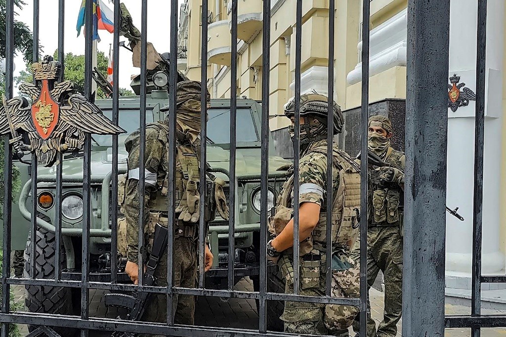 Members of the Wagner Group military company guard an area at the headquarters of the Southern Military District in Rostov-on-Don, Russia, Saturday, June 24, 2023 (AP Photo)