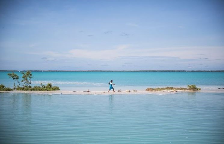 A man walks in Kiribati, a tiny, island nation spread across an area roughly the size of Australia. (UNICEF)
