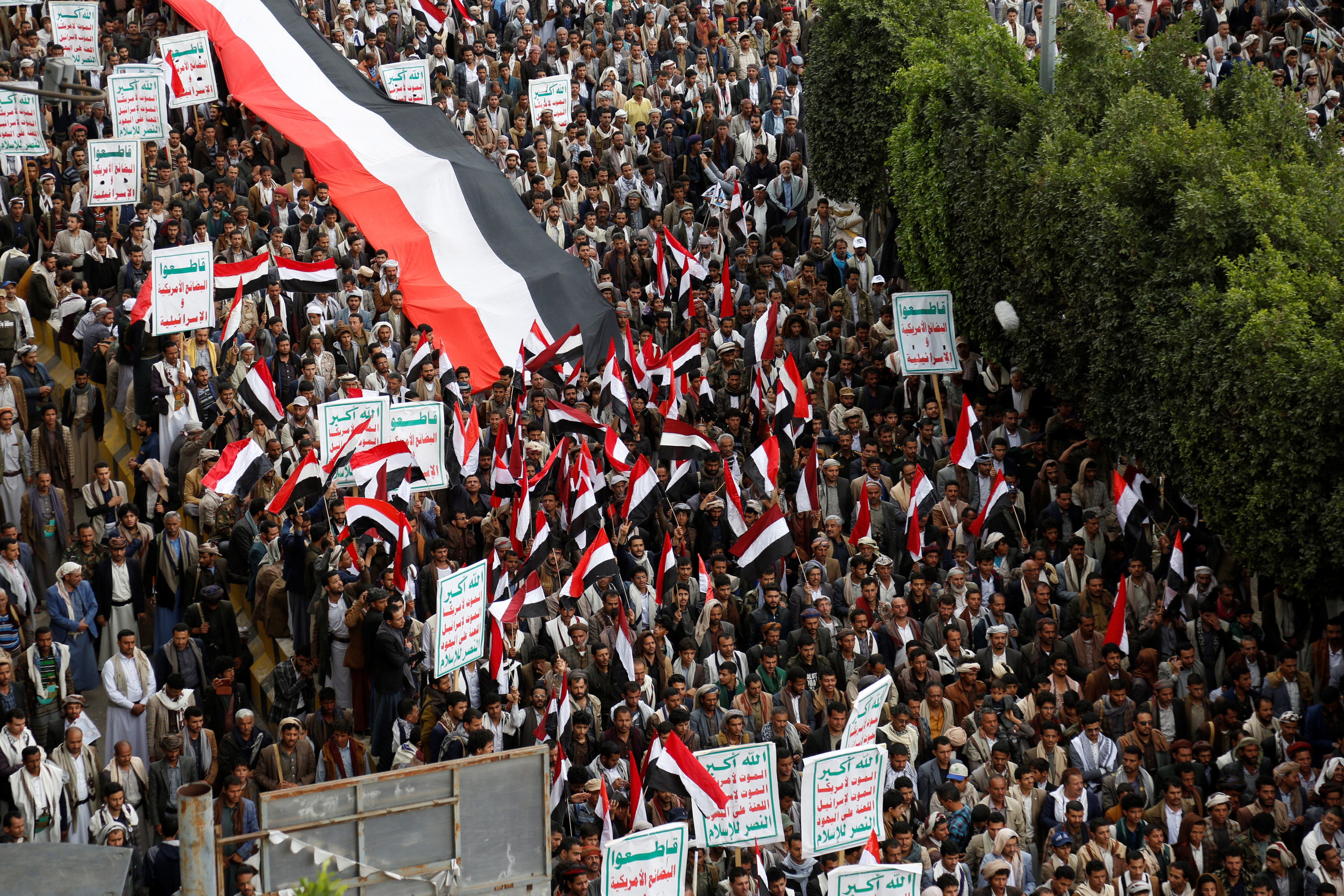 Yemeni people chant slogans as they attend a rally, Friday, March 26, 2023, in Sanaa, Yemen. (AP)
