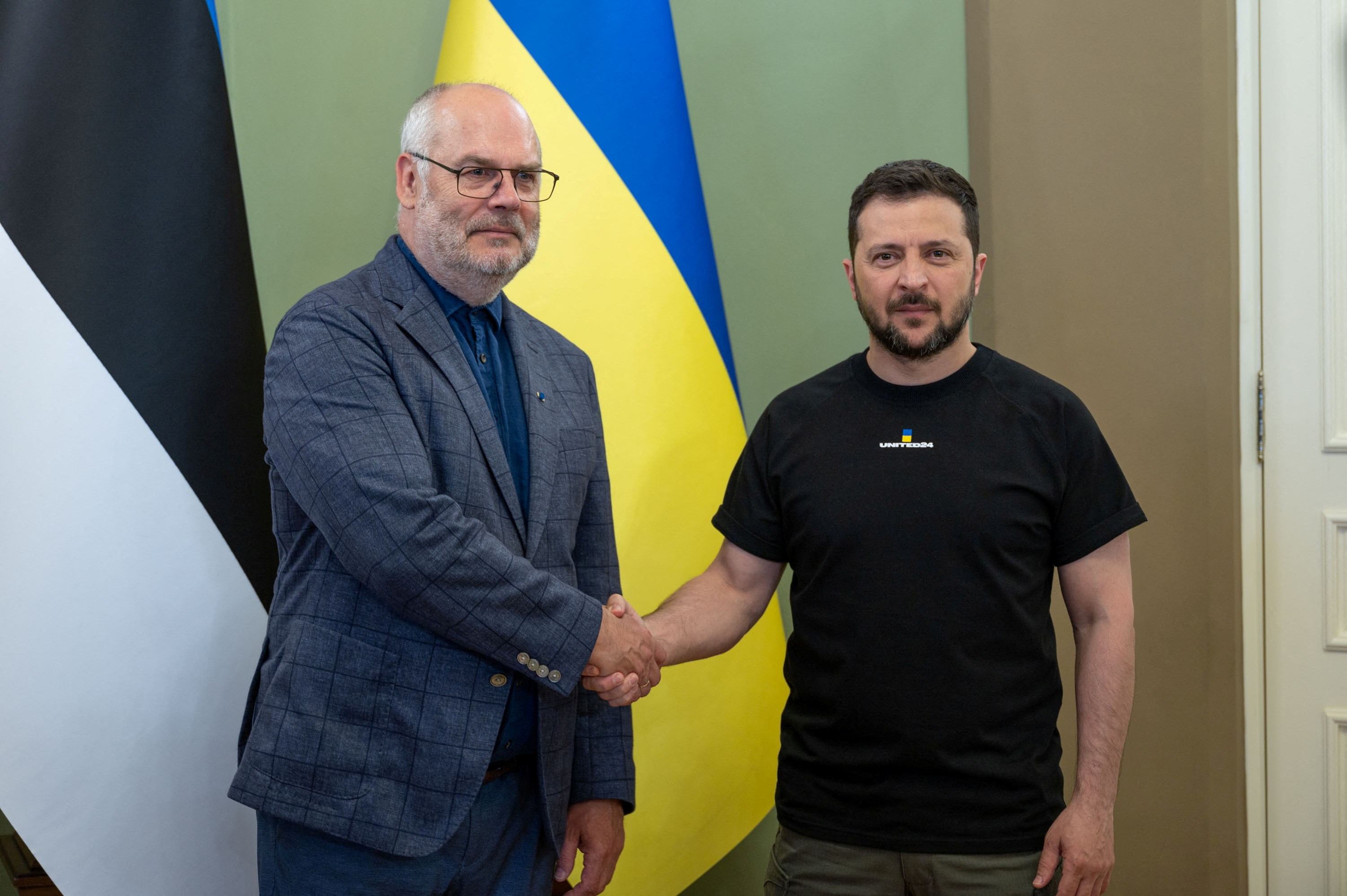Ukrainian President Volodymyr Zelensky shakes hands with Estonian President Alar Karis, Kiev, Ukraine, June 2 2023. (Reuters)