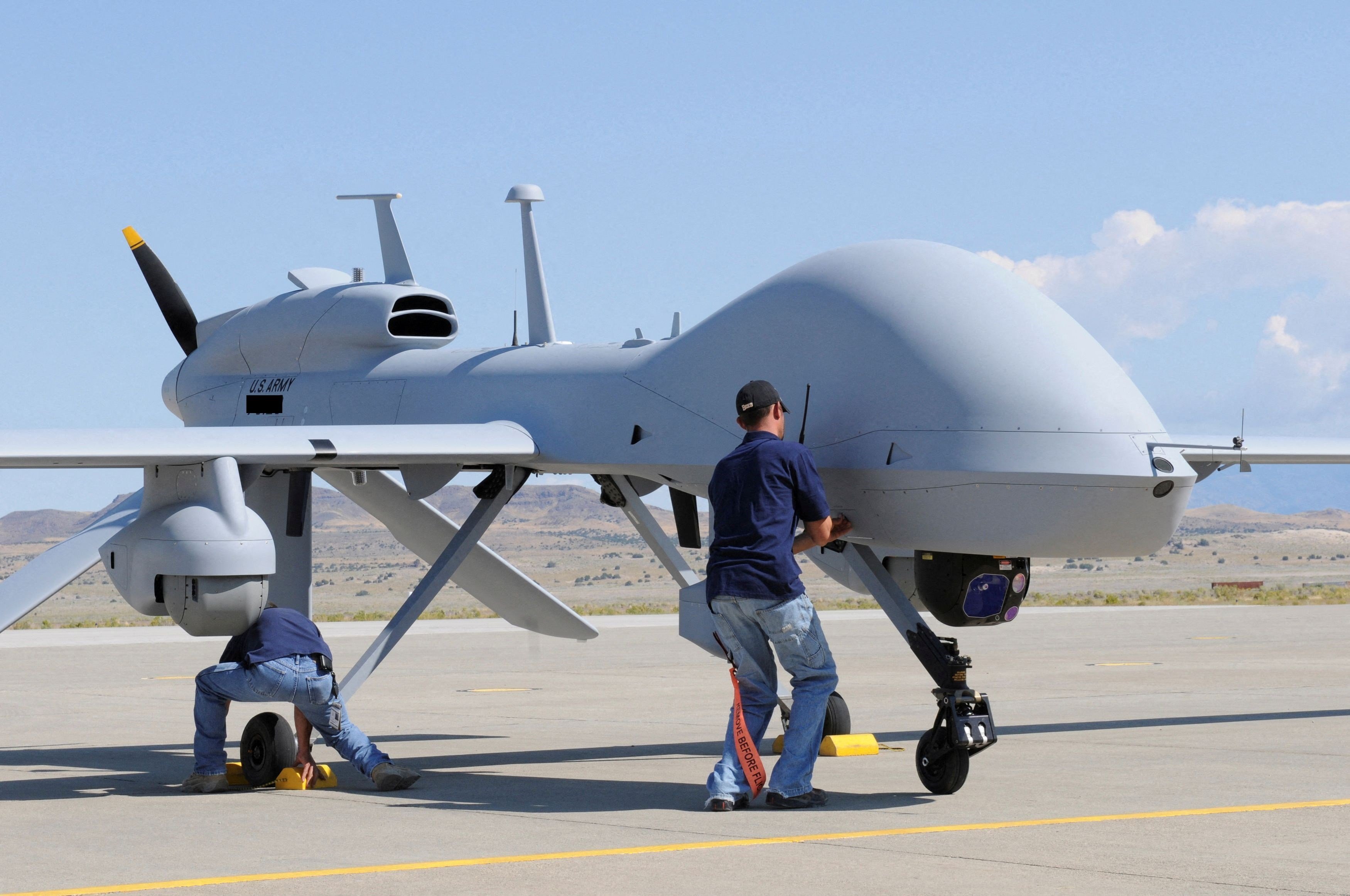 Two workers prepare a MQ-1C Gray Eagle UAV for display at the Michael Army Airfield, Utah, US, September 15 2011. (Reuters)