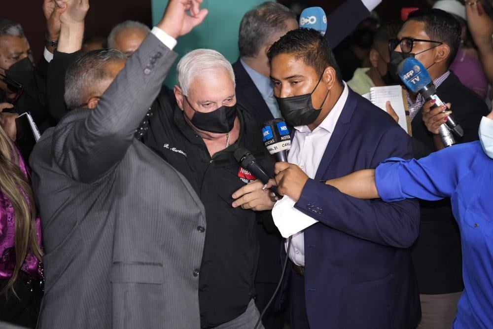 Panama's former President Ricardo Martinelli, center, talks to reporters as he leaves a courthouse after he was found not guilty of political espionage, in Panama City, Tuesday, Nov. 9, 2021. (AP)