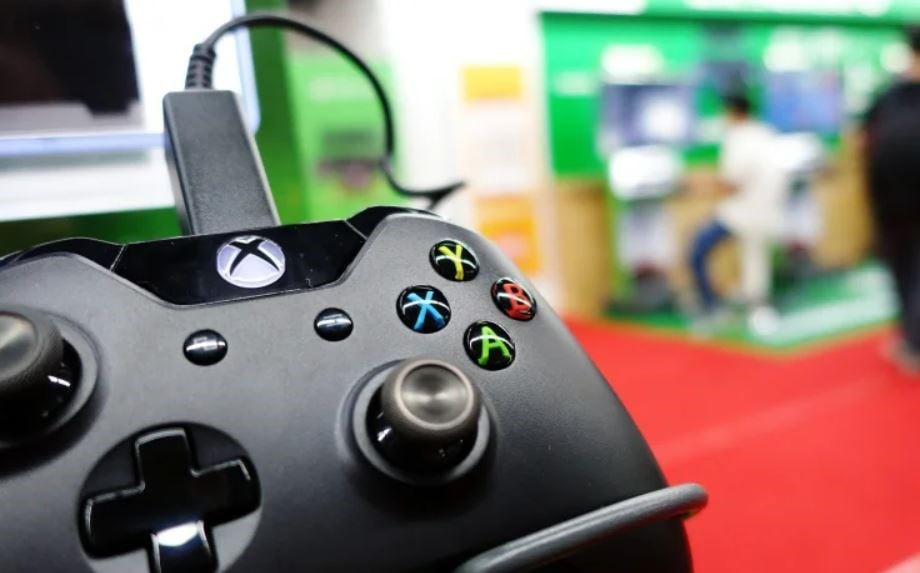 A control of a Microsoft's Xbox One game console is taken in a shop in Shanghai on September 29, 2014. (AFP)