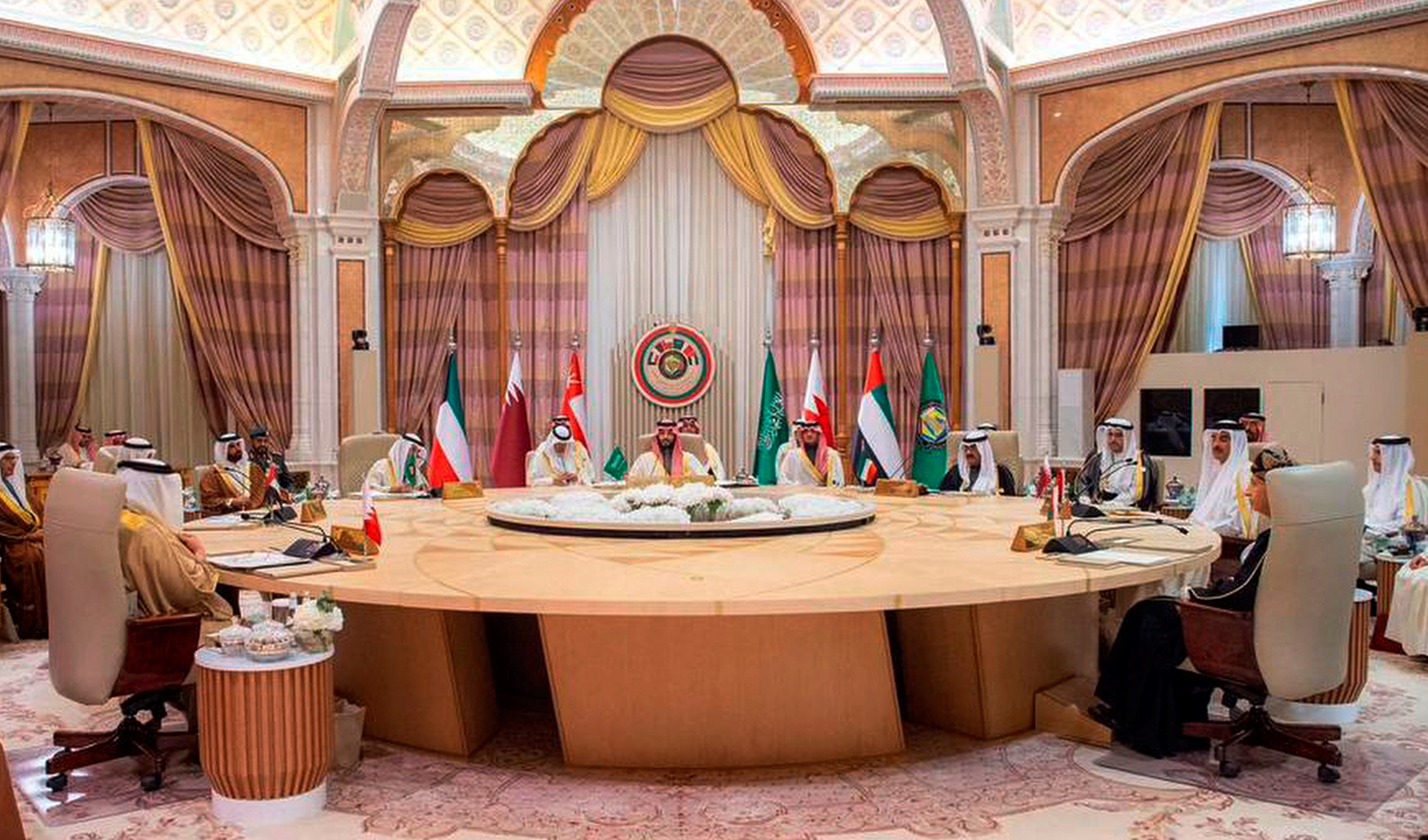 In this photo made available by Saudi Press Agency, SPA, Saudi Crown Prince Mohammed bin Salman, talks with Gulf Arab leaders during the Gulf Cooperation Council (GCC) Summit, in Riyadh, Saudi Arabia, Friday, Dec. 9, 2022.