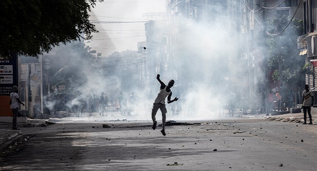 A demonstrator hurls a stone, Senegal, on June 1, 2023 during a protest. (AFP)