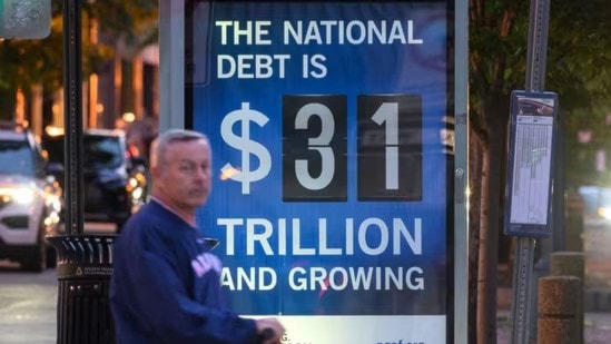 A poster at a bus shelter shows the national debt in Washington, DC in an undated photo (AFP)
