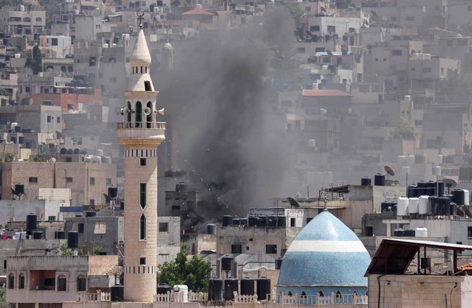 Smoke billows during an Israeli military operation in Jenin city in the occupied West Bank, on July 3, 2023. (AFP)