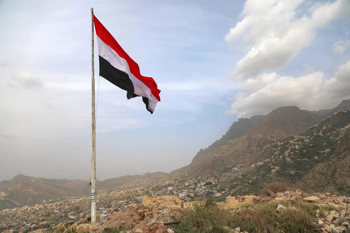 A Yemeni flag waves in the city of Taez (AFP)