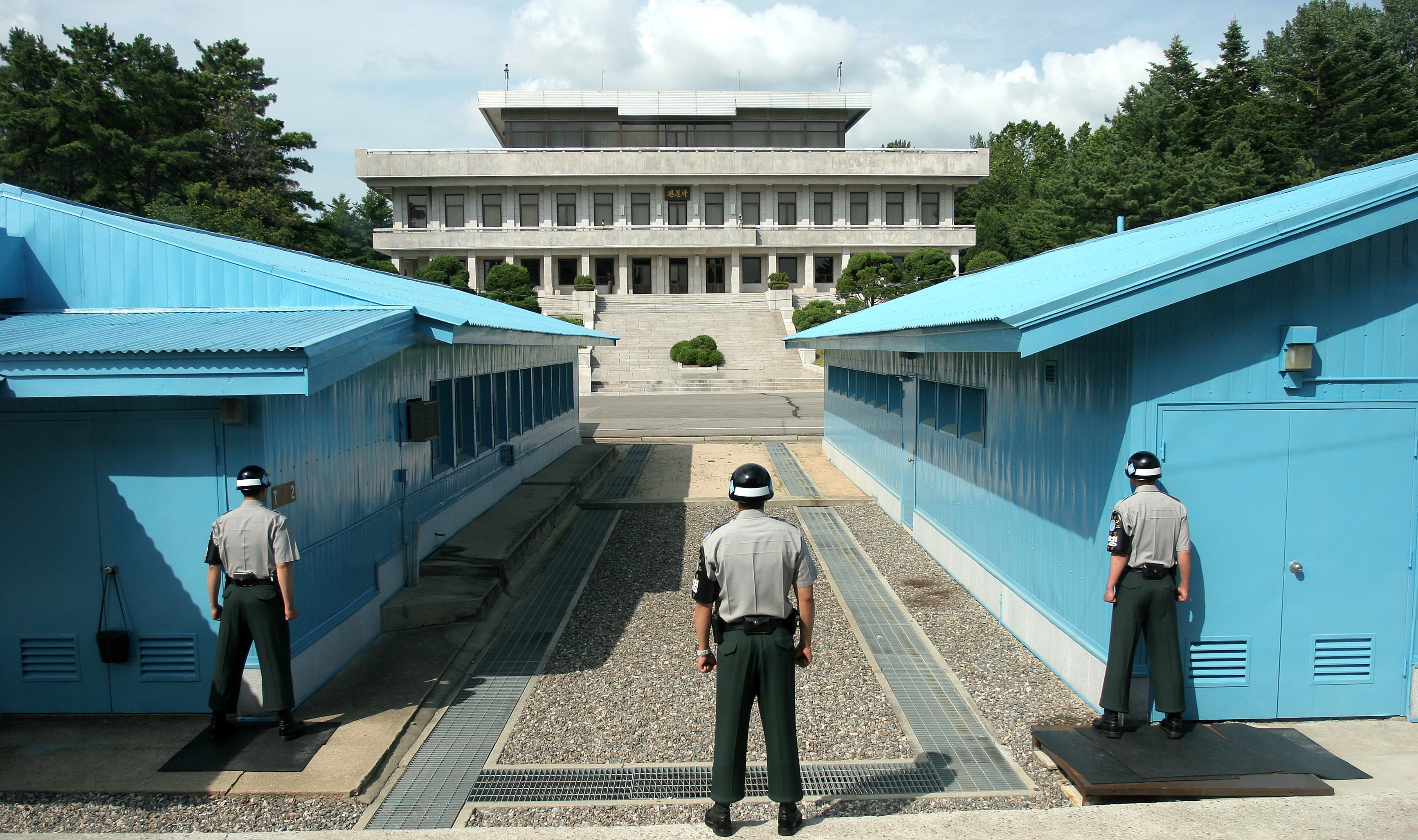 Three ROK soldiers watching the border at Panmunjeom in the DMZ between North and South Korea (Wikipedia Commons/Henrik Ishihara)