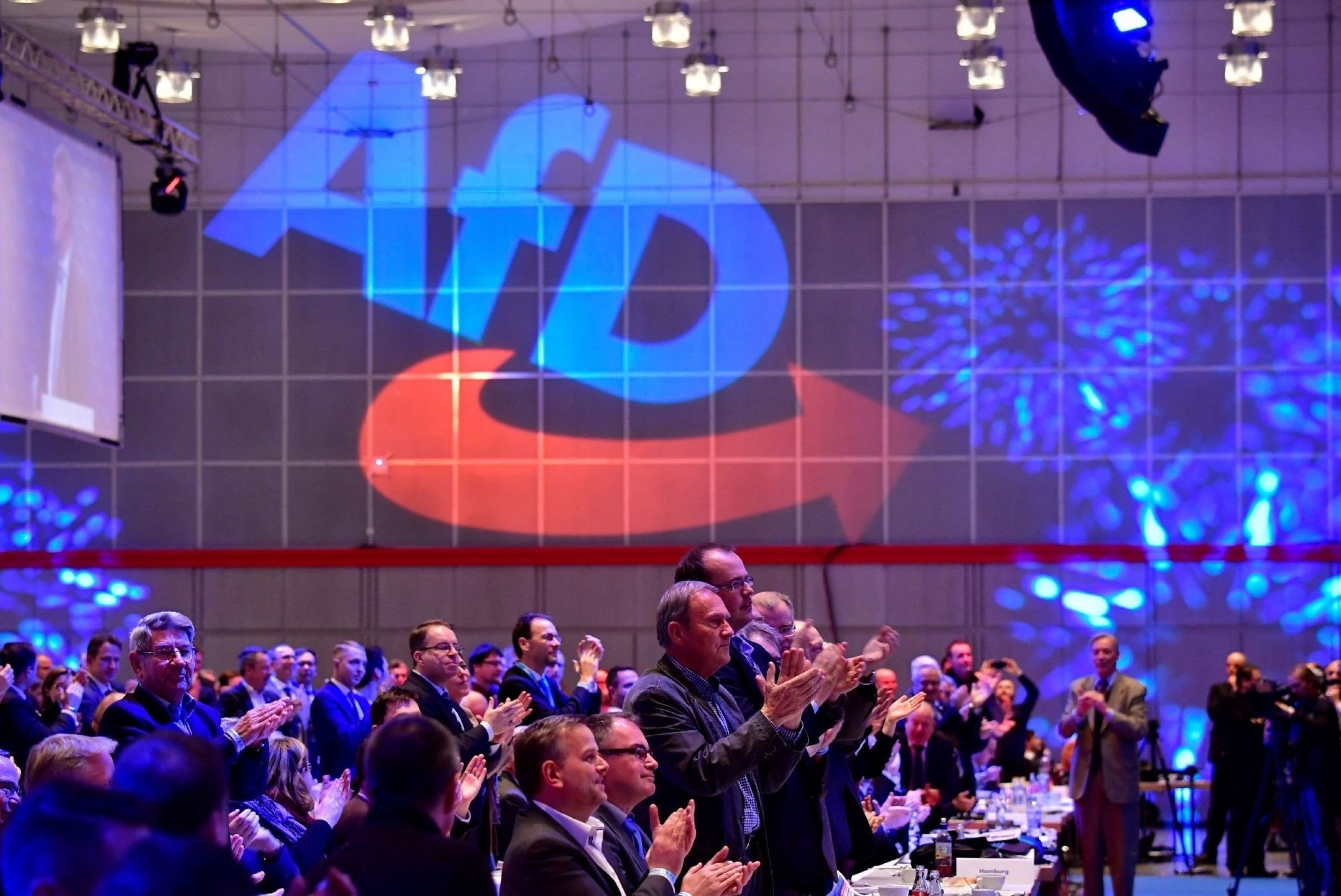 Members of the Islamophobic and anti-immigration Alternative for Germany far-right party applaud during the congress of the party in Hanover, Germany, December 2 2017. (AFP)