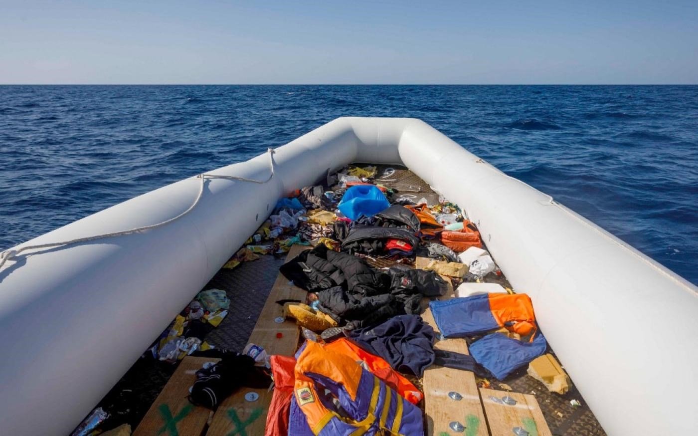 An empty inflatable boat following the rescue of about 90 people by the Spanish NGO Maydayterraneo in the Mediterranean off the Libyan coast on 9 February 2020 (AFP)