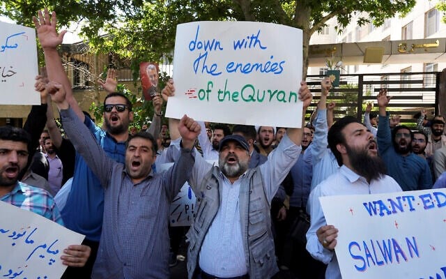 Iranian demonstrators chant slogans during a protest of the burning of a Quran in Sweden, in front of the Swedish Embassy in Tehran, Iran, June 30, 2023. (AP)