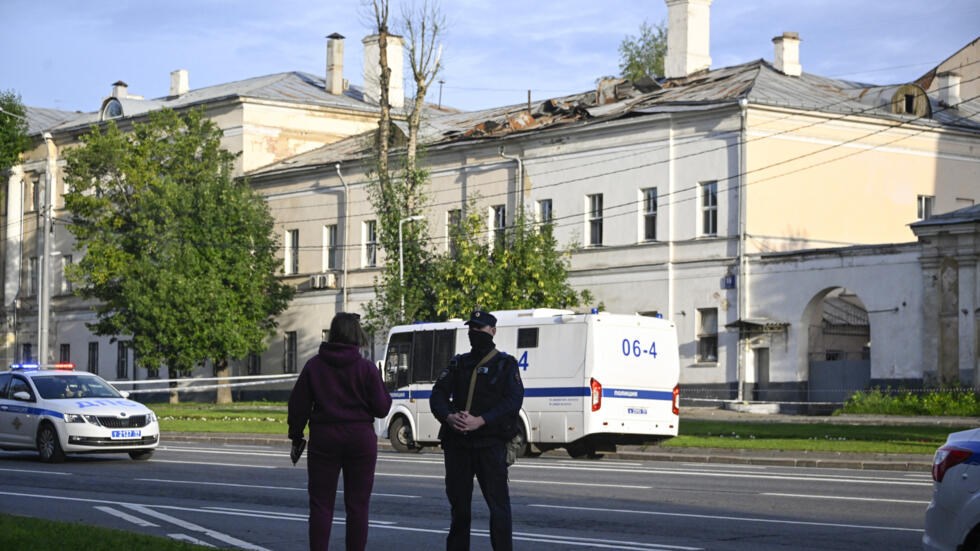 A police officer secures an area outside a damaged non-residential building on Komsomolsky Prospekt after a reported drone attack in Moscow on July 24, 2023 (AFP)