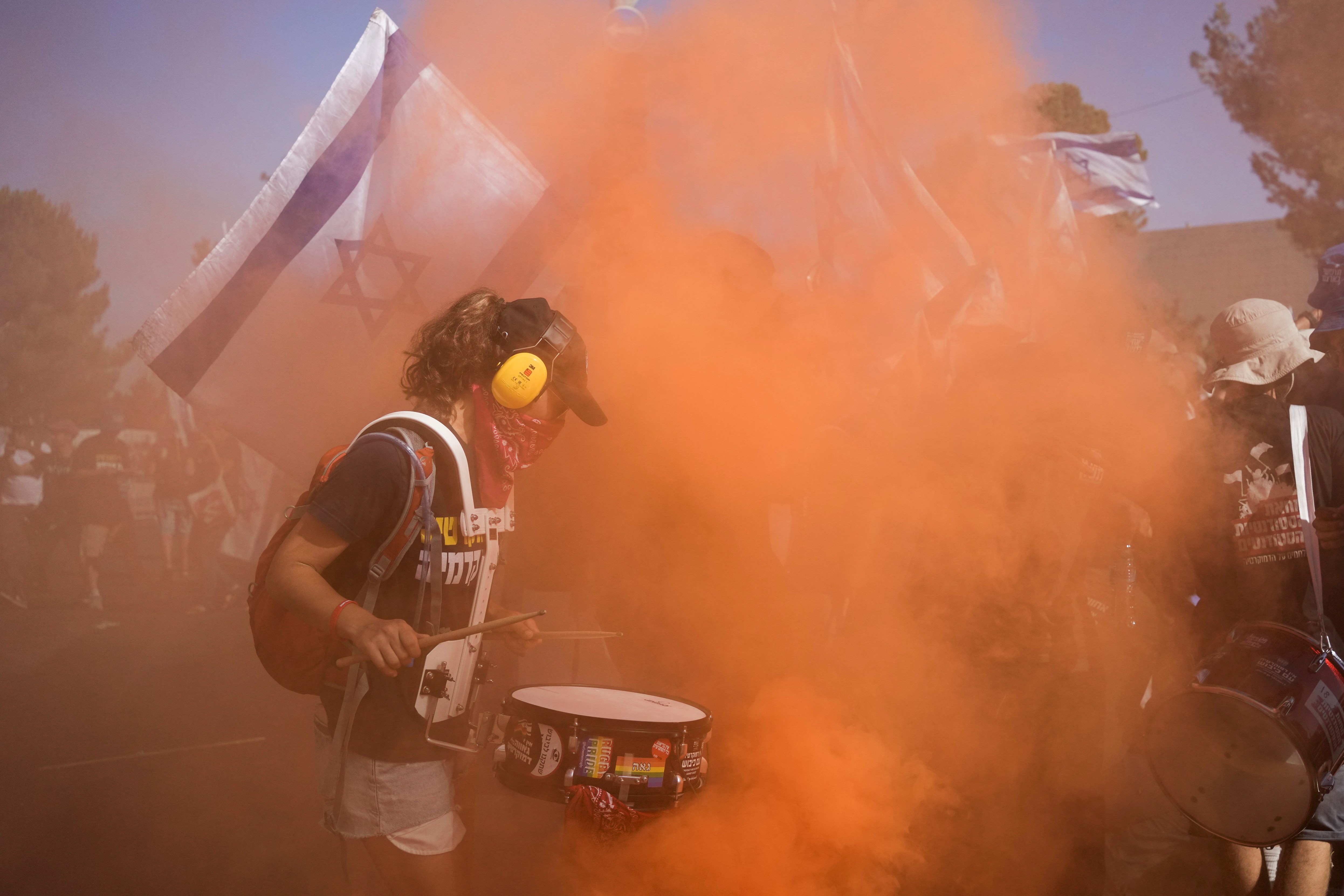 Israeli settlers protest against Israeli Occupation Prime Minister Benjamin Netanyahu's judicial overhaul plan outside the parliament in occupied Al-Quds, Monday, July 24, 2023. (AP)