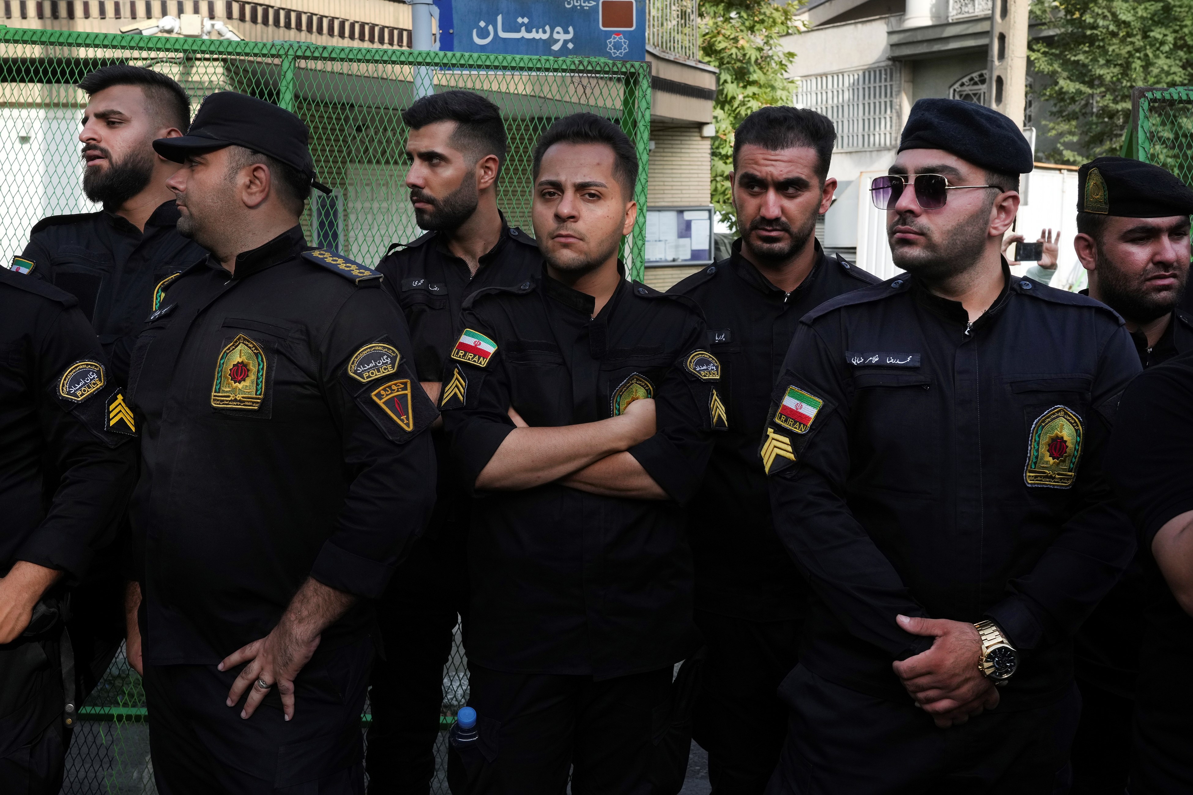 Iranian police officers stand guard during a protest against Sweden in front of the Swedish Embassy in Tehran, Iran, Friday, July 21, 2023. (AP)