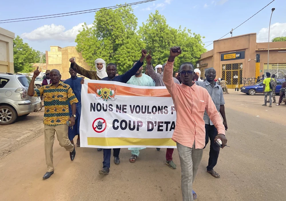 Supporters of Nigerian President Mohamed Bazoum demonstrate in his support in Niamey, Niger, Wednesday July 26,2023. (AP)