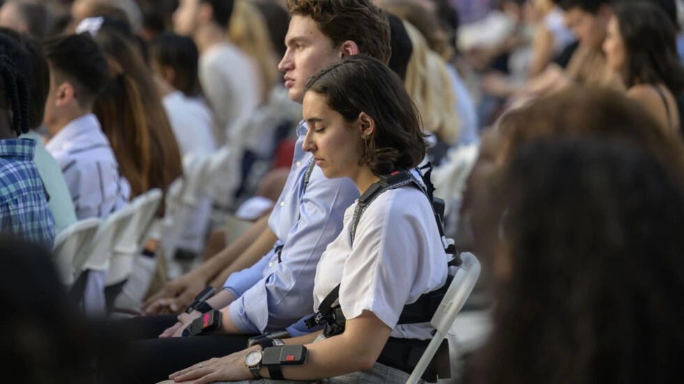 Concertgoers in New York wear haptic suits, which translate music into vibrations on the body, created for the deaf community (AFP)